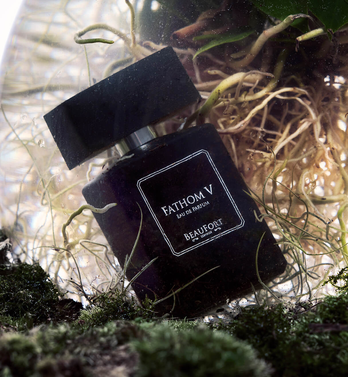 A bottle of BeauFort London's Fathom V Eau De Parfum, floating at the bottom of a lake