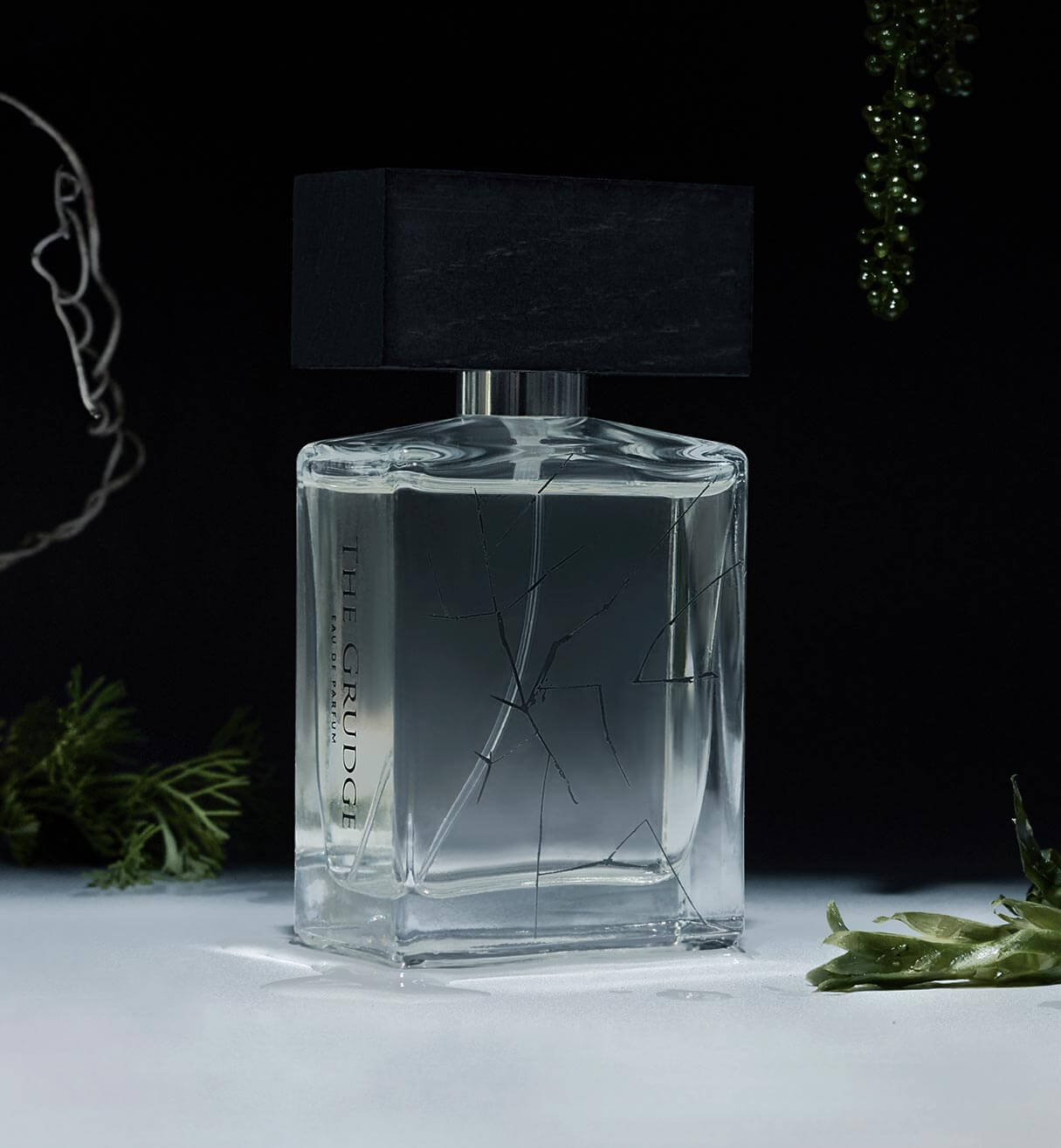 BeauFort London's The Grudge Eau De Parfum bottle surrounded by premium botanicals