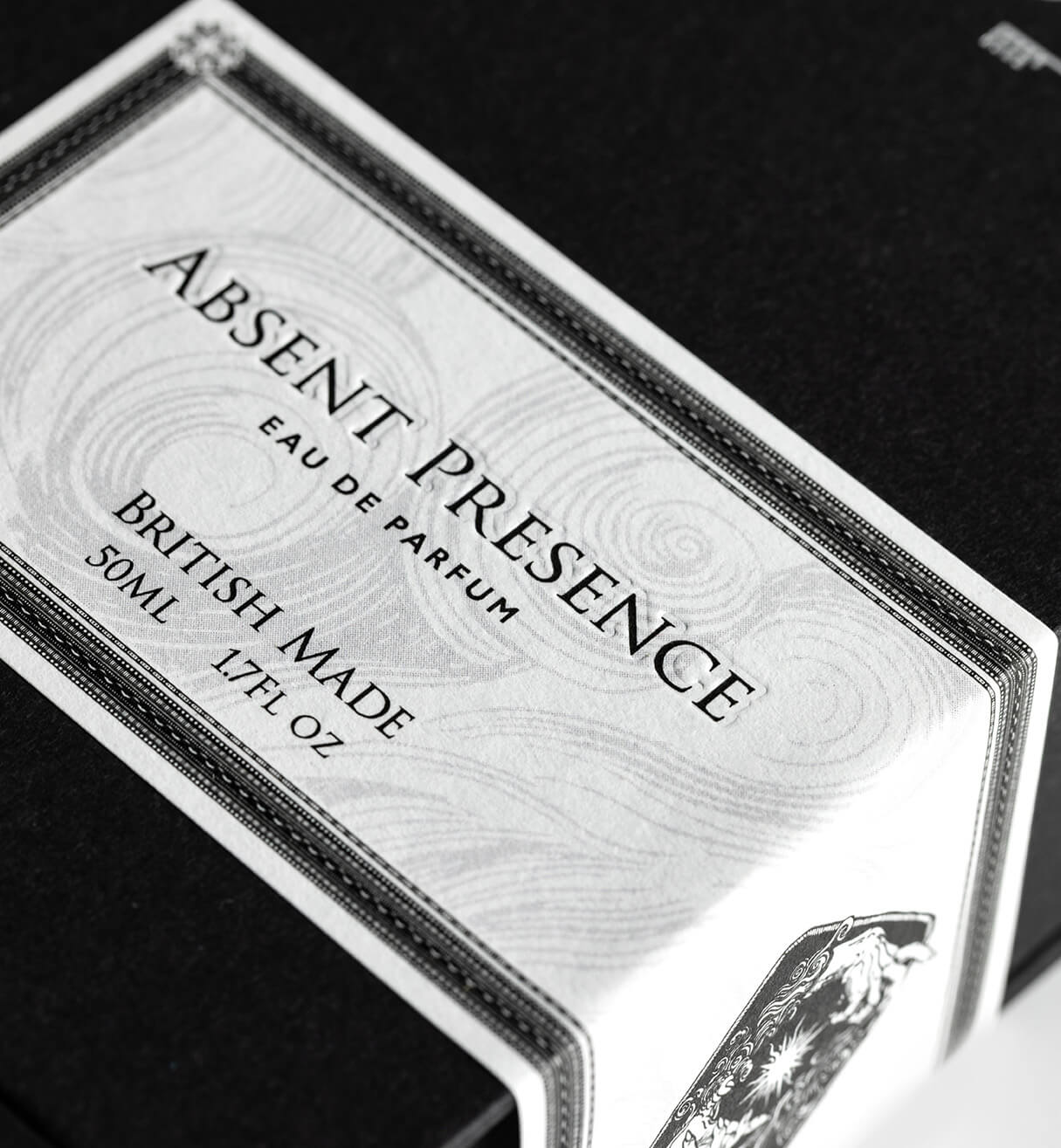 Close-up of Absent Presence Eau de Parfum premium label detail