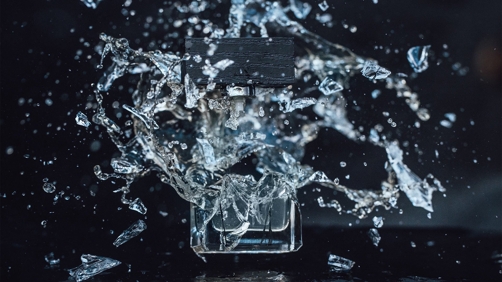 A bottle of Beaufort London 'The Grudge' Eau De Parfum being smashed into pieces.