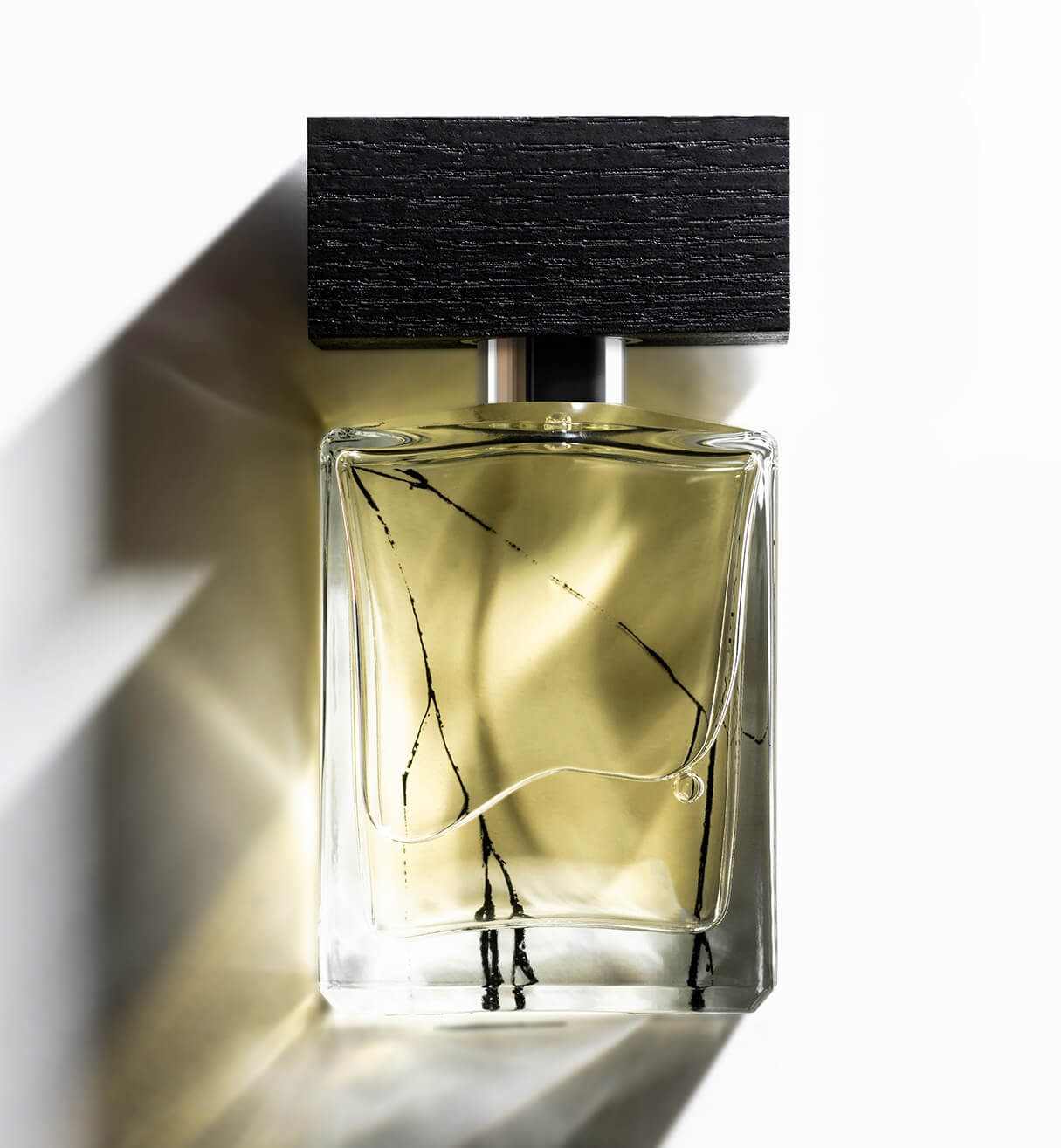 A bottle of Beaufort London's  'Cape Wrath' Eau de Parfum bottle on a white background with heavy shadows